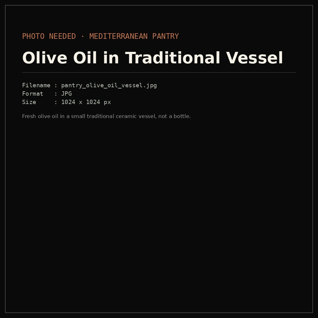 Fresh olive oil in a small traditional ceramic vessel, not a bottle.